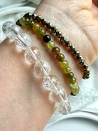 Rainbow Quartz, Tsavorite Garnet, and faceted Pyrite bracelet stack with luminous crystal gemstones and layered luxury styling