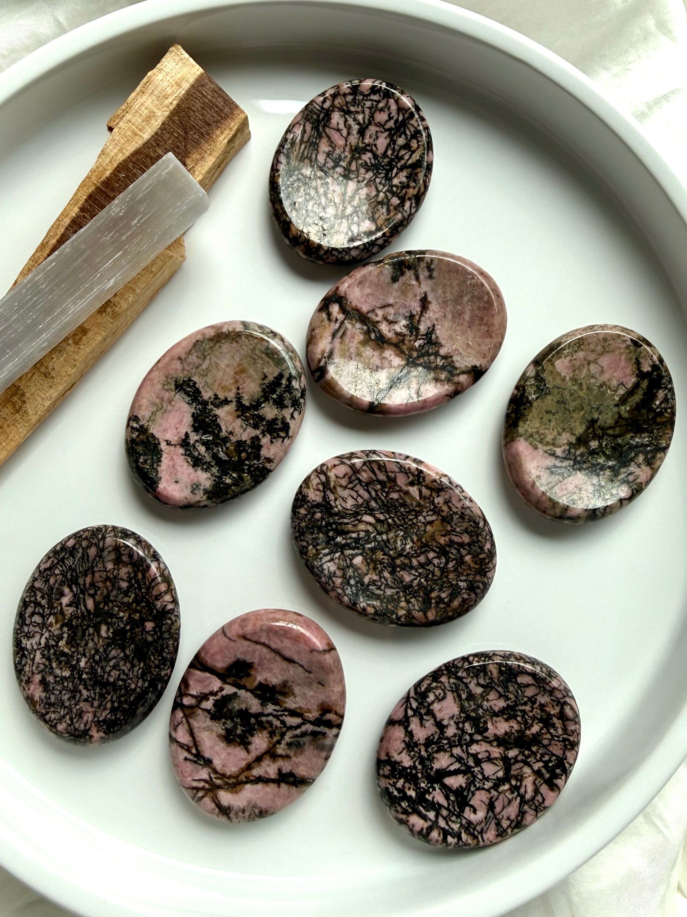 Polished Rhodonite thumb stones with natural pink and black patterns