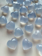 Polished Blue Chalcedony heart crystals in pale blue tones, soothing healing stones for calm energy and mindful rituals