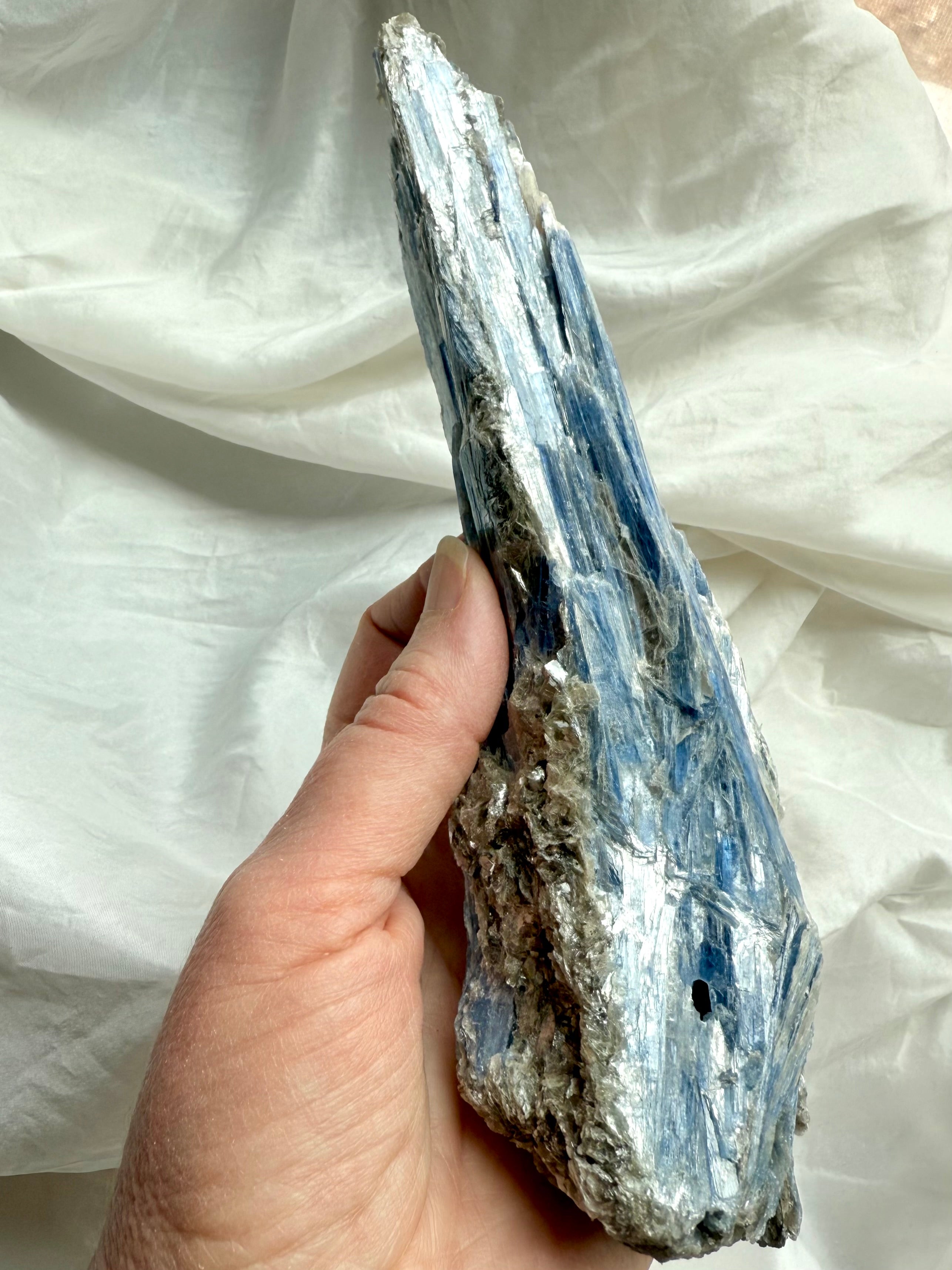 raw blue kyanite crystal blades with muscovite shimmer, natural healing stone