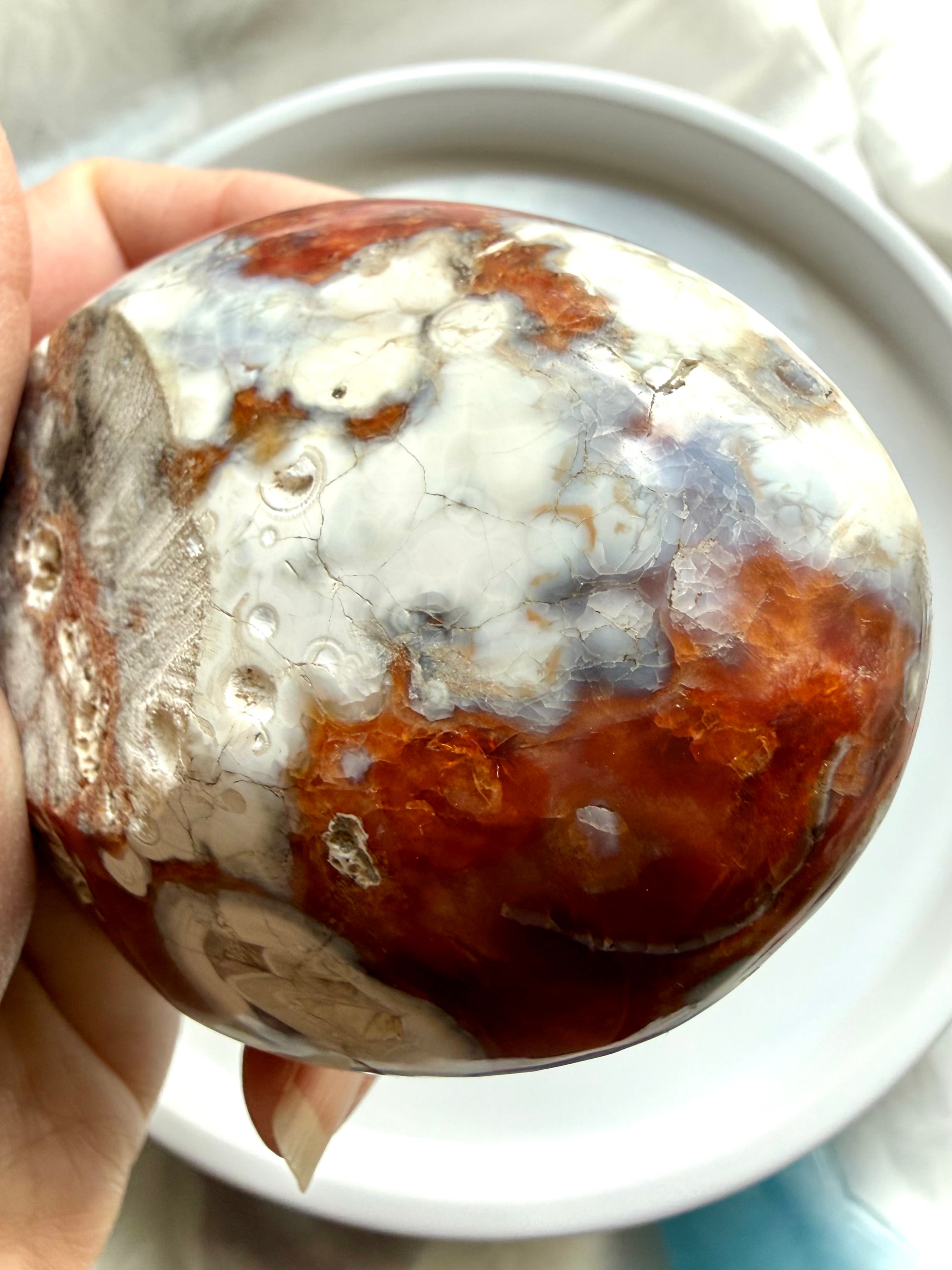 side view of carnelian crystal bowl with layered agate bands and quartz core