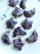 Lepidolite moon and star crystal carvings in mottled lilac and deep purple for calm, emotional balance and inner peace