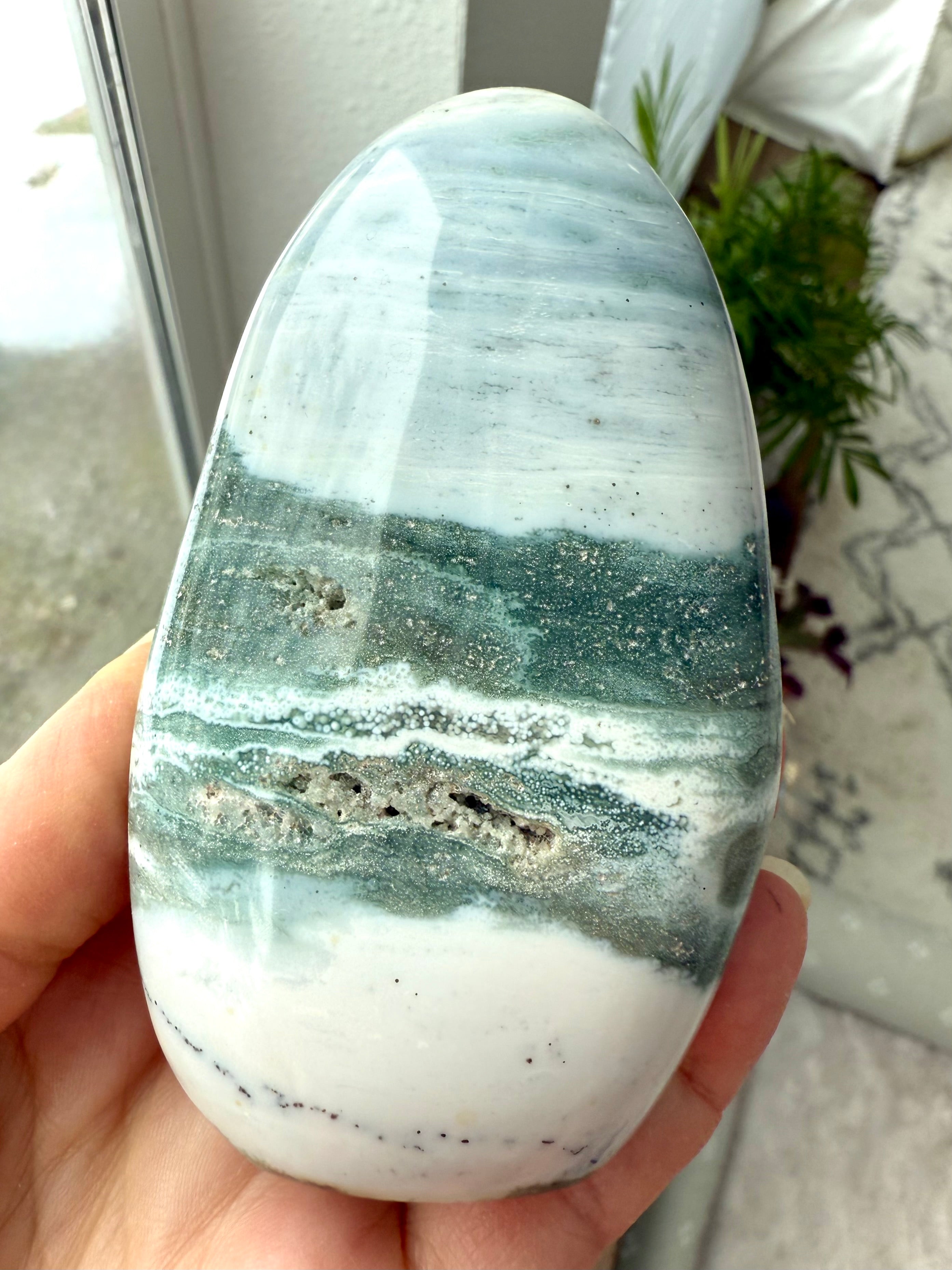 A rare Blue Ocean Jasper Freeform with swirling teal, green, bluish gray + white patterns