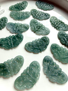 Blue Water Jade butterfly carvings in light, medium and dark teal jade from Guatemala