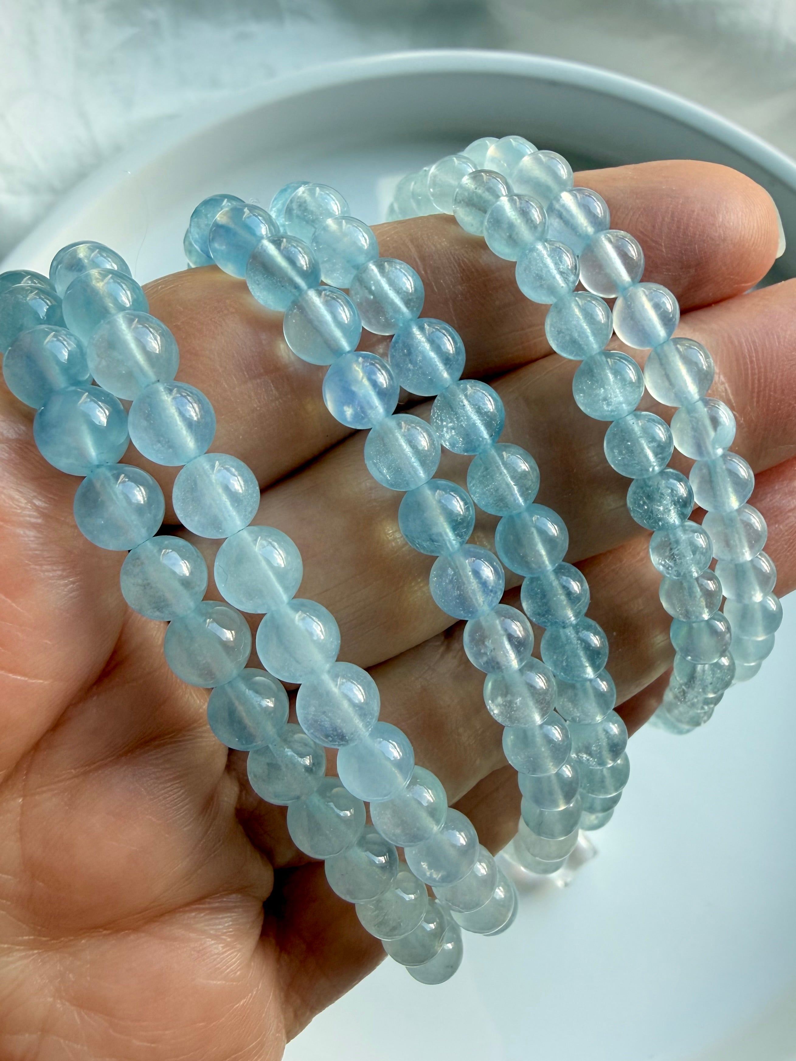 Stacked Aquamarine crystal bracelets in ombré blue tones – March birthstone gemstone jewelry 