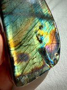 Polished Labradorite freeform with colorful rainbow flash in gold, aqua, green, orange, pink, and blue tones
