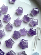 Mini Amethyst star carvings with soft lavender and purple tones, polished crystal stars for peace, clarity, and calming energy