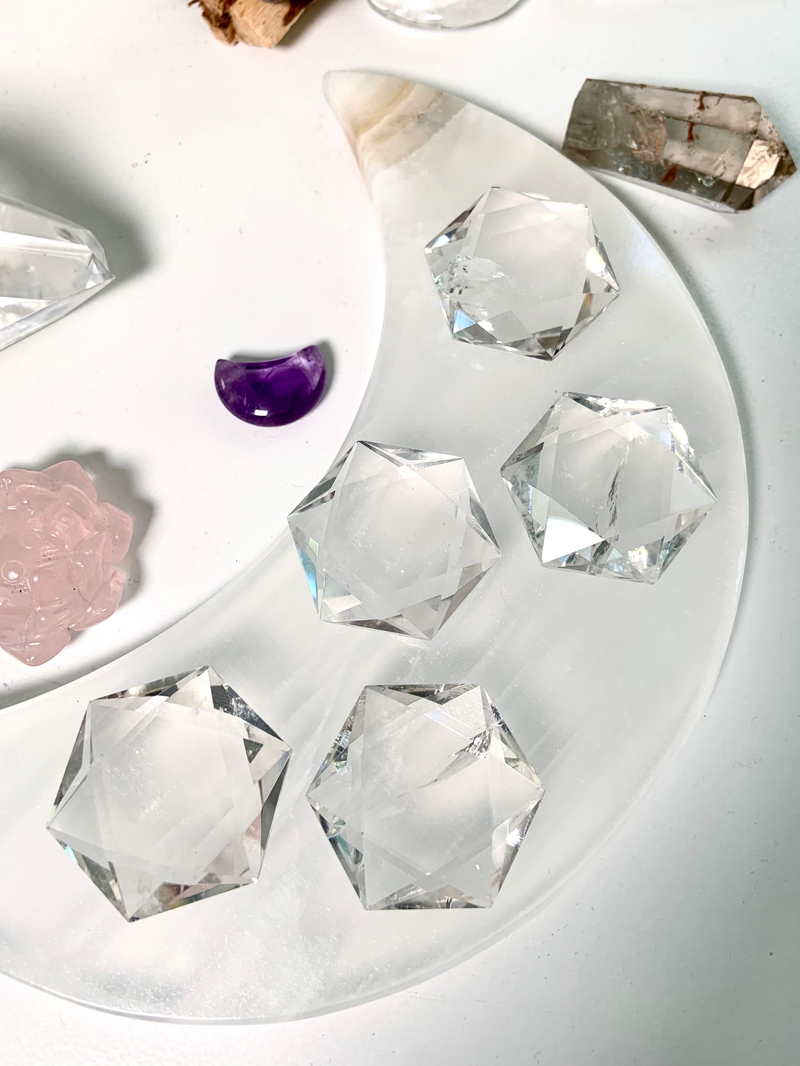 Faceted Quartz Crystal Hexagons shown on a moon plate