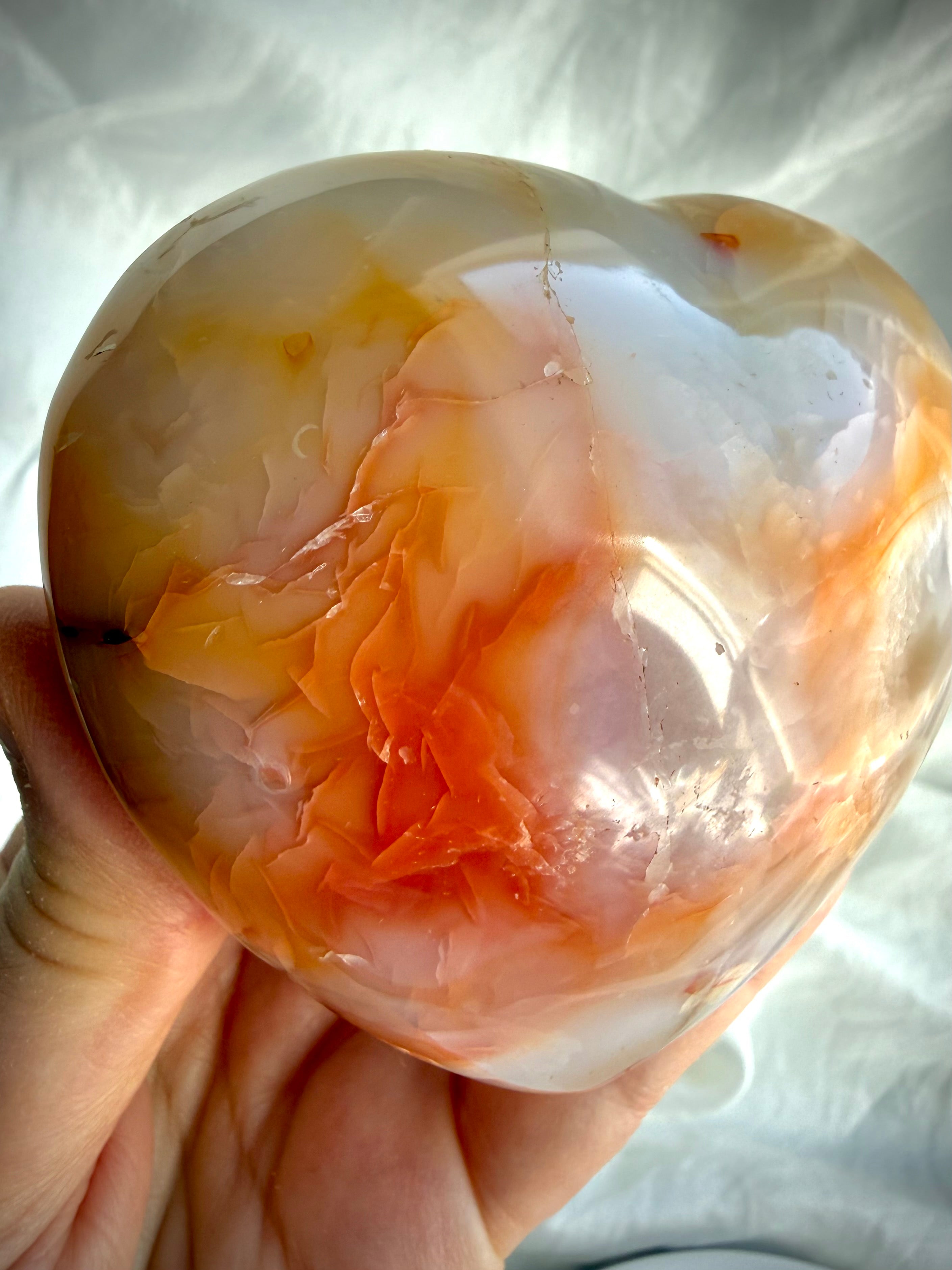 One-of-a-kind Carnelian heart with translucent orange banding and natural color variations in polished finish