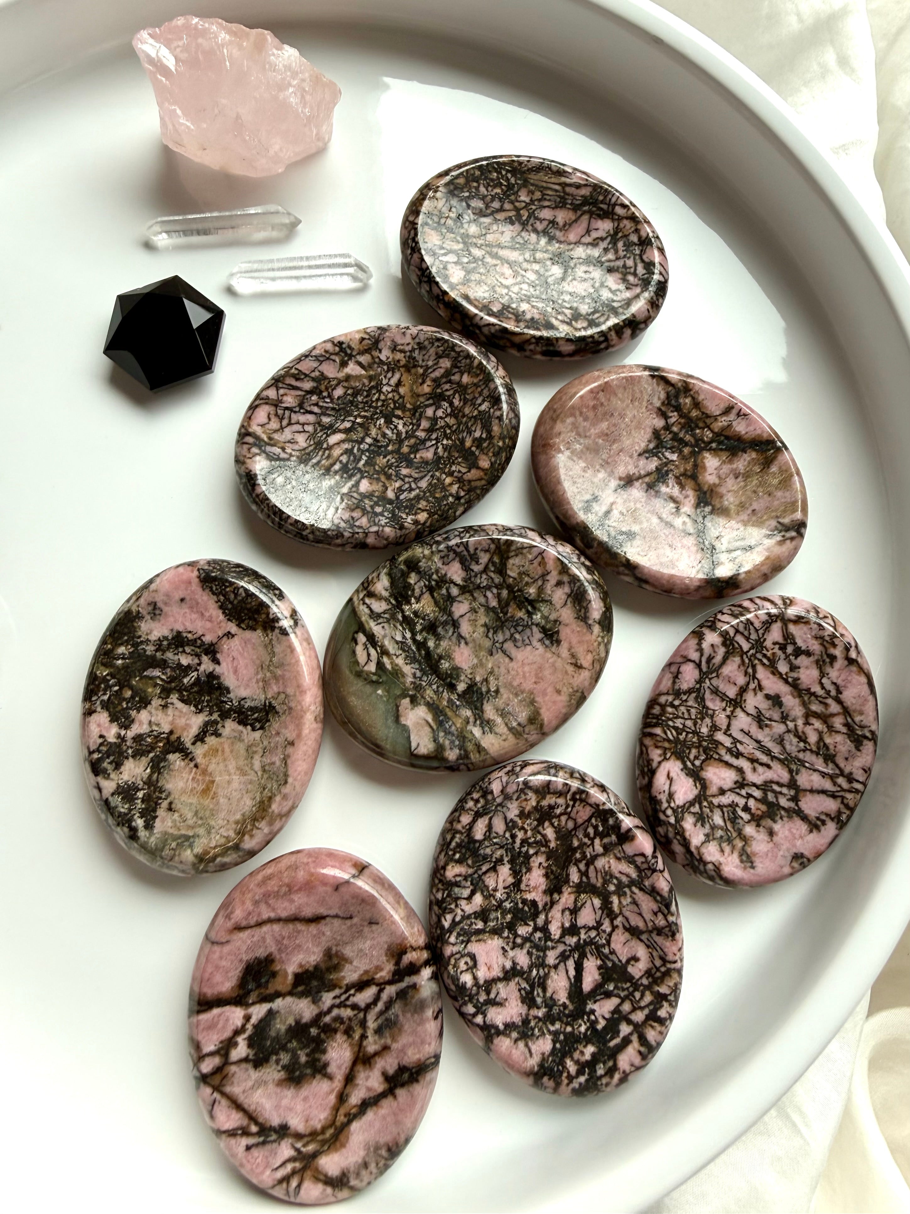 Natural Rhodonite worry stones with pink and black manganese matrix for Heart Chakra healing