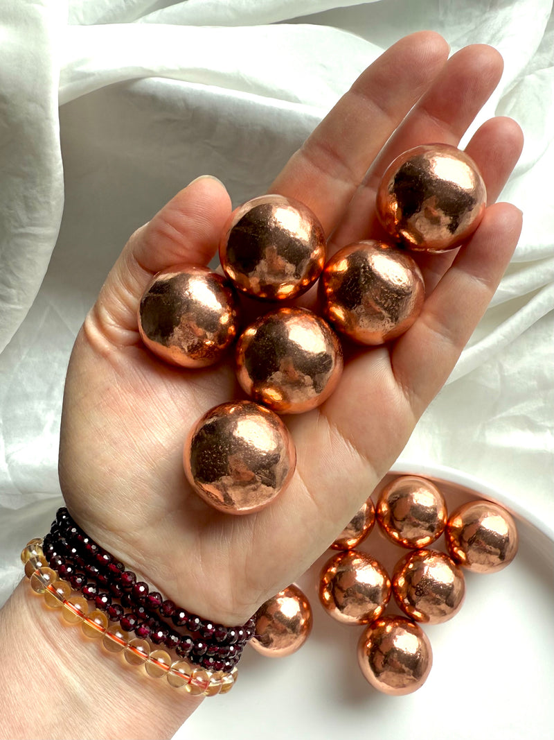 30 mm diameter Michigan copper spheres shown in my hand for scale