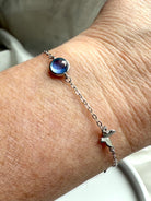 Sterling silver aquamarine butterfly bracelet with blue gemstone centerpiece, dainty jewelry for clarity, peace, and gift giving 