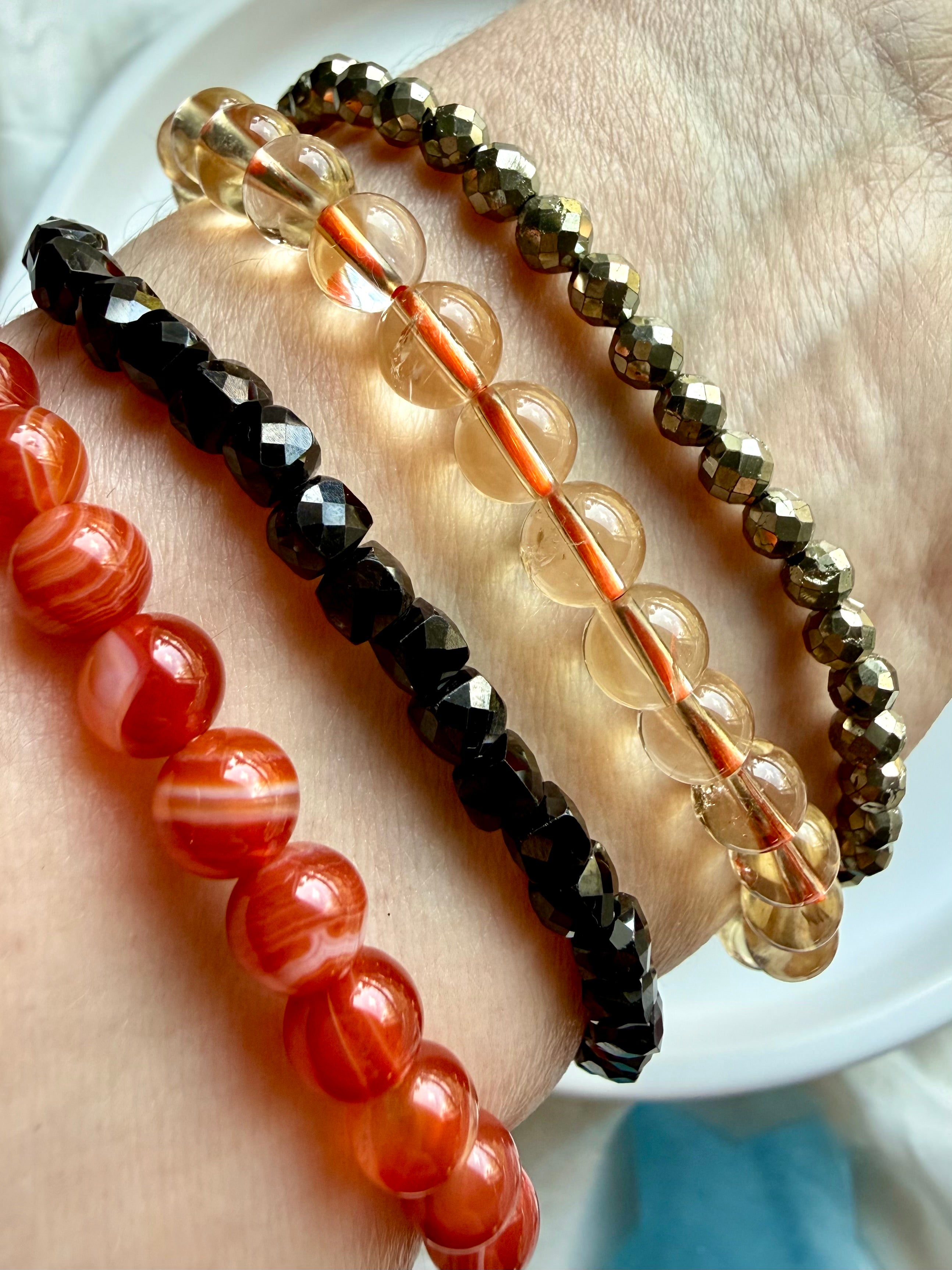 faceted pyrite bracelet with carnelian citrine and black spinel bracelets for abundance confidence and grounding stack