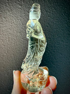 rear view of natural Citrine Quan Yin statue highlighting carved robe details and crystal clarity