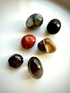 Six Root Chakra stones for grounding, protection, and energy work with Bloodstone, Black Obsidian, and Red Jasper