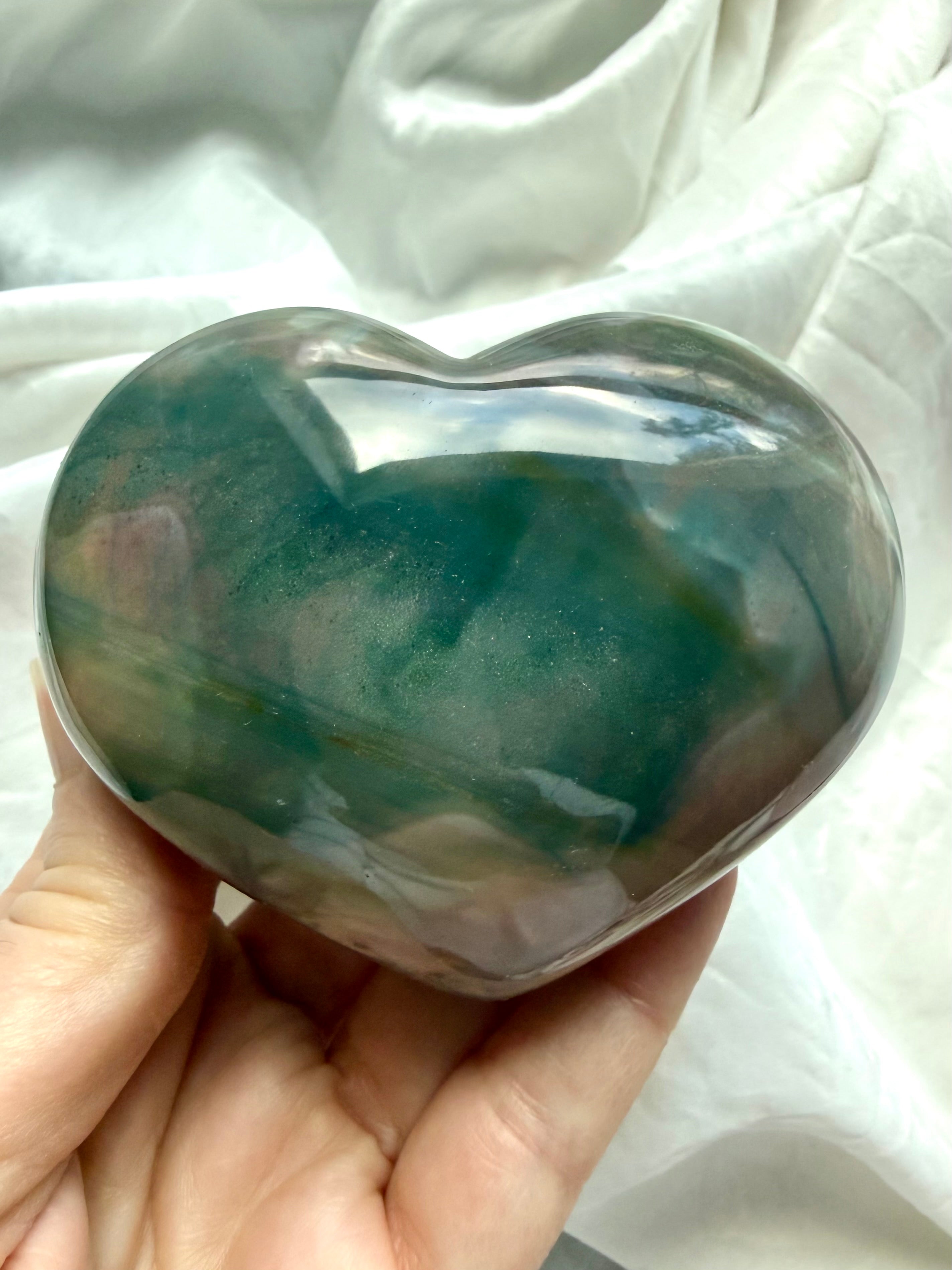 Chunky polished Ocean Jasper heart crystal with dreamy seafoam green and peachy pink color zoning in hand