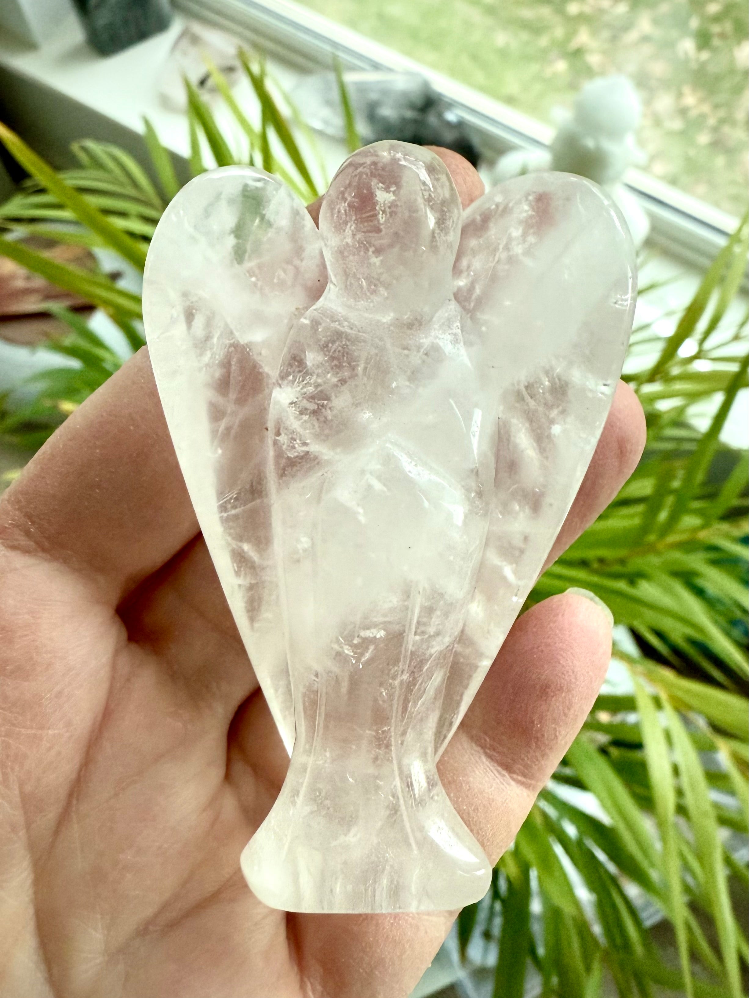 This luminous quartz crystal angel figurine brings a nurturing, protective energy to your space