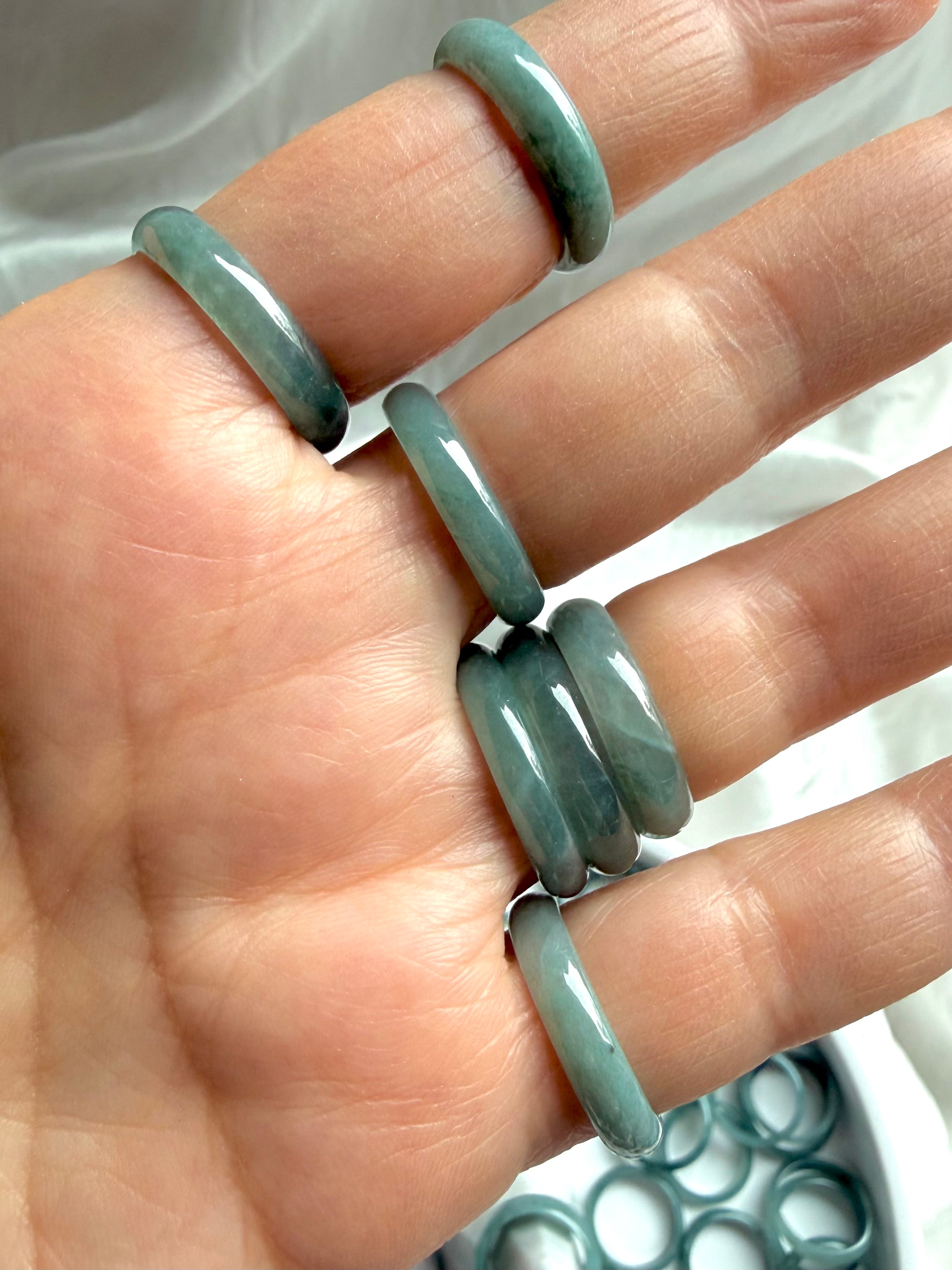 Rounded Blue Water jadeite band rings worn on hand, natural Guatemalan jade crystal jewelry
