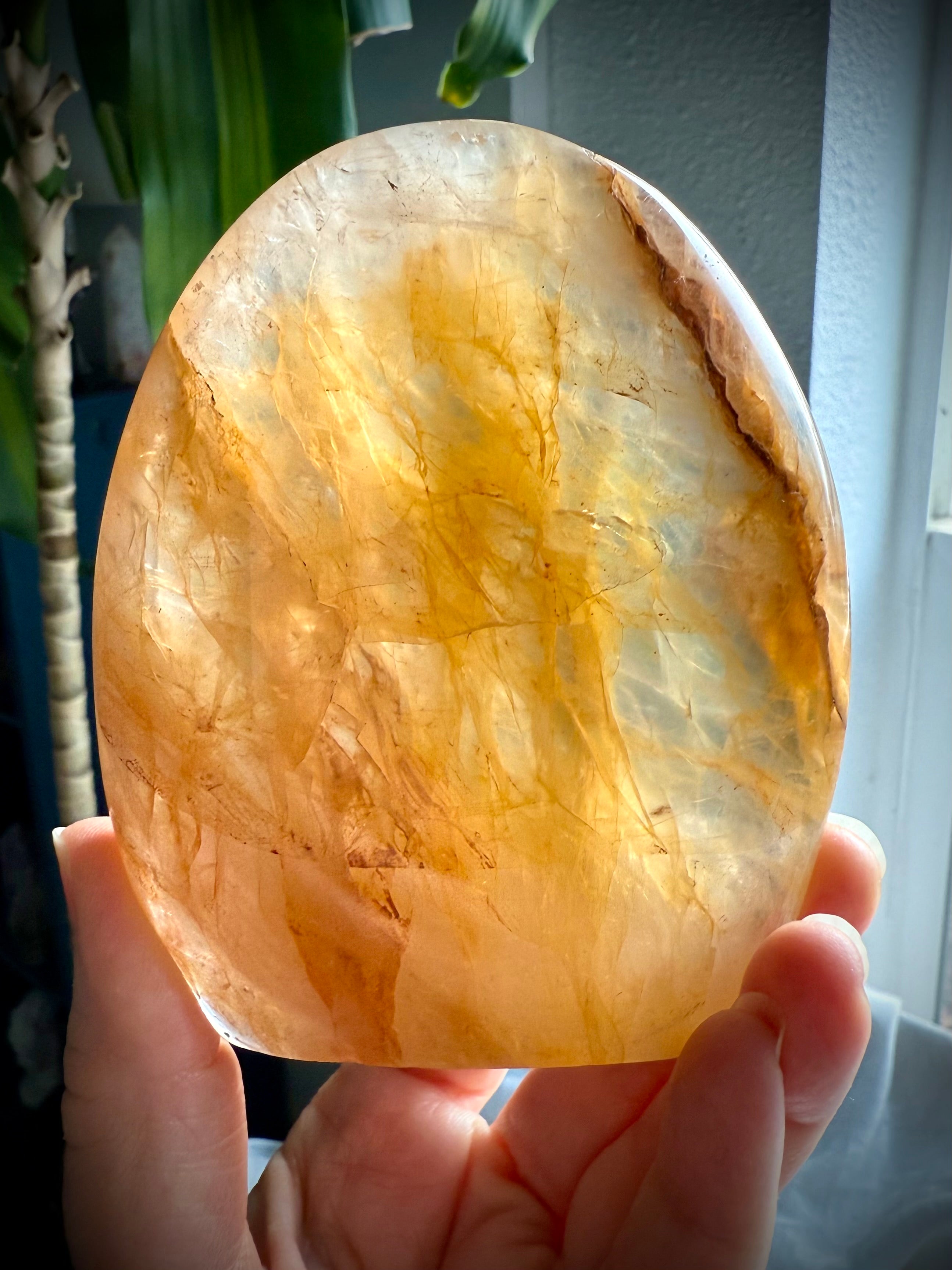 High-quality Golden Healer Quartz freeform crystal with glowing honey gold inclusions and natural light