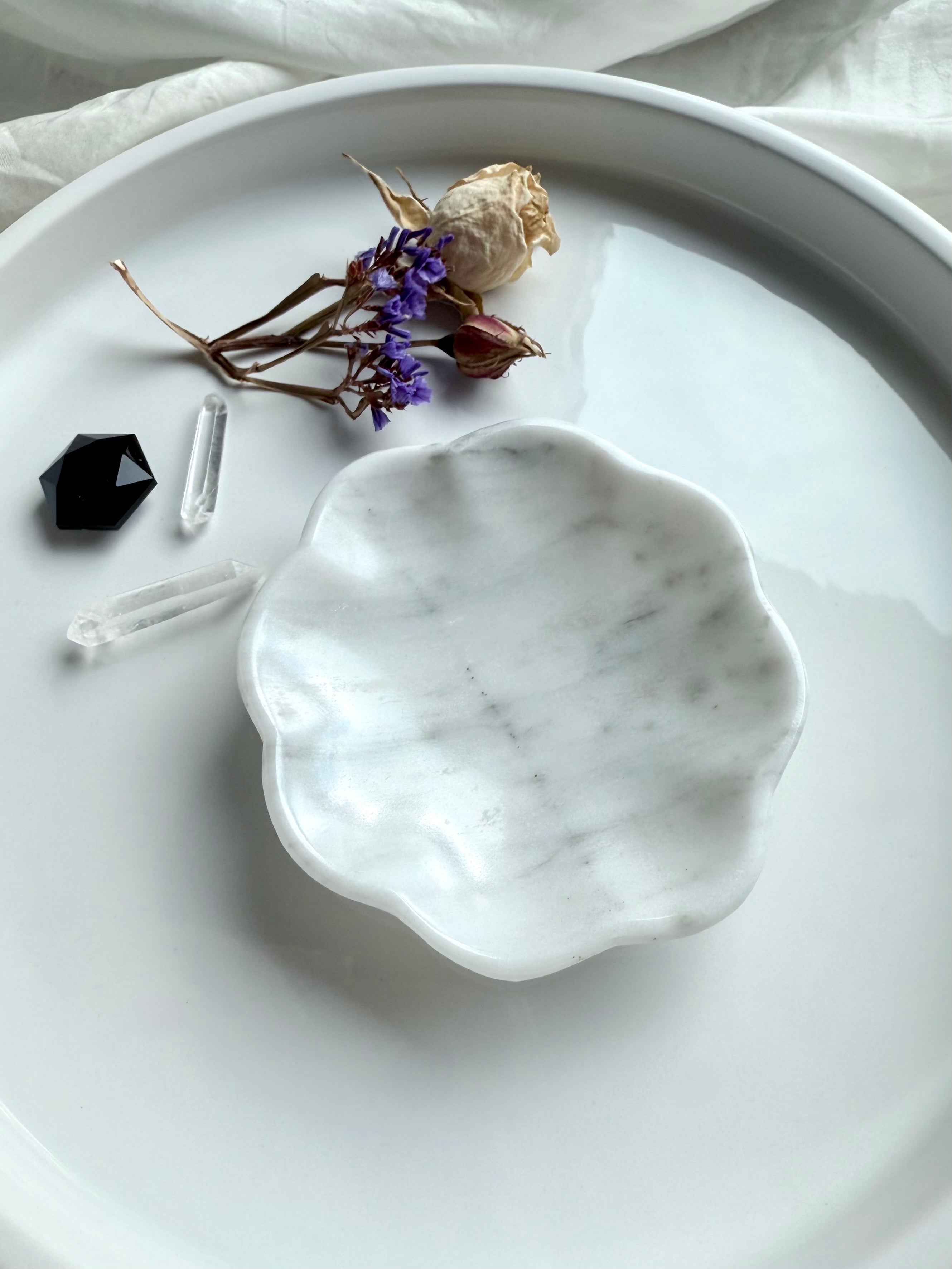 White marble daisy bowl with scalloped edges, styled empty with dried flowers and crystals