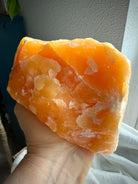 Large self-standing Orange Calcite crystal with bold natural formations and rich honey-orange coloration