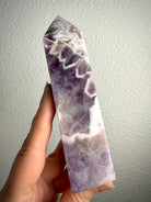 Dream Amethyst tower with dramatic purple and white Chevron Amethyst patterns, polished crystal point for spiritual protection and mental clarity