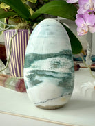 A rare Blue Ocean Jasper Freeform with druzy + swirling teal, green, bluish gray + white patterns