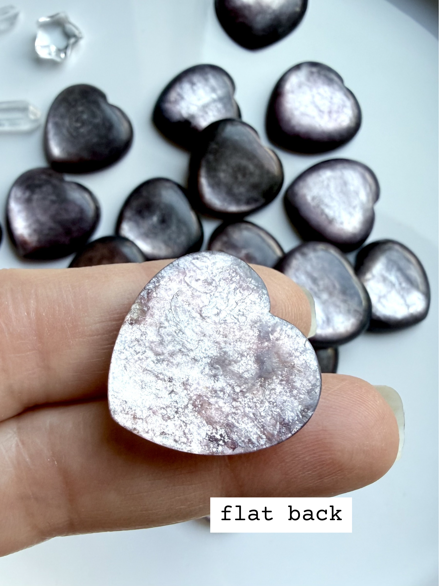 Gem lepidolite heart flat back cabochon showing smooth back and natural mica patterning