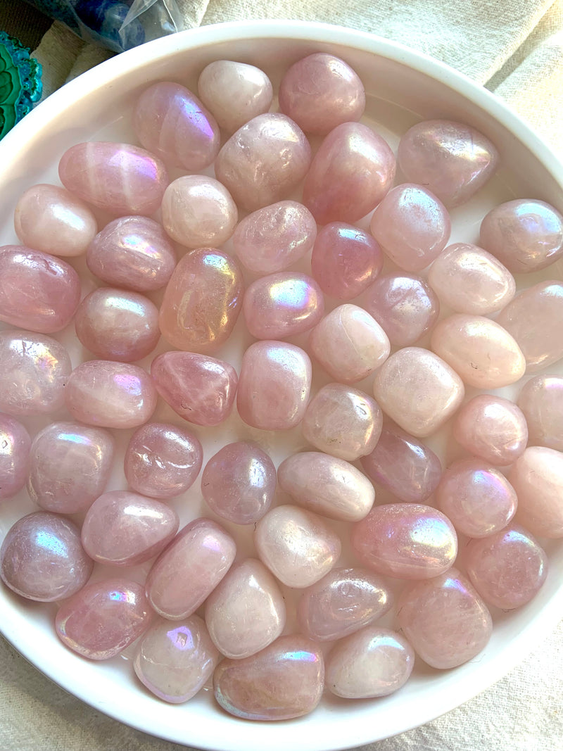 Angel Aura Rose Quartz Tumbles shown on a white plate.