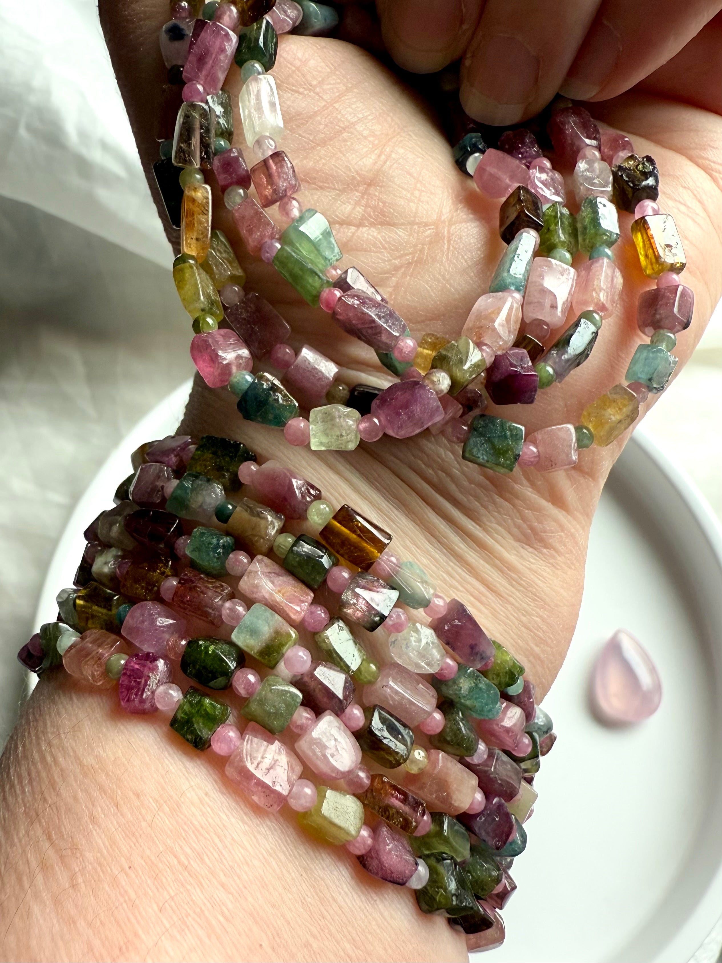 Wear your Rainbow Tourmaline bracelet to open the heart chakra with inspiration + compassion