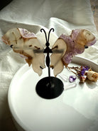 Druzy Amethyst Butterfly Wings on black metal stand, carved agate wings with lavender amethyst druzy, crystal décor for transformation and healing energy.