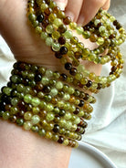 Tsavorite Garnet bracelets with luminous green gemstone beads in olive, chartreuse, amber, and deep forest tones