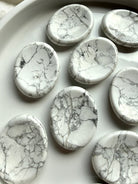 Natural Howlite worry stones with white and gray veining, polished oval shape and calming tactile design