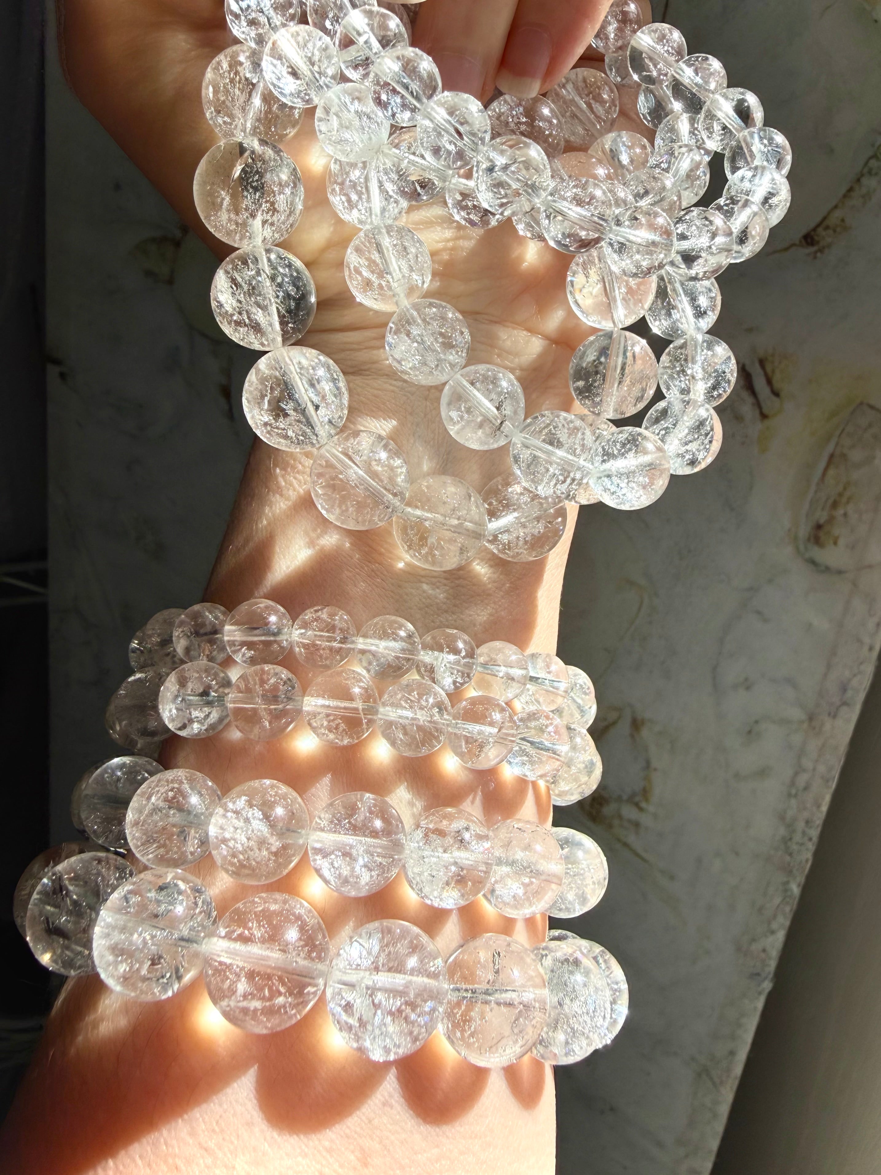 Rainbow Clear Quartz bracelet stack with high clarity crystal beads and luminous rainbow inclusions