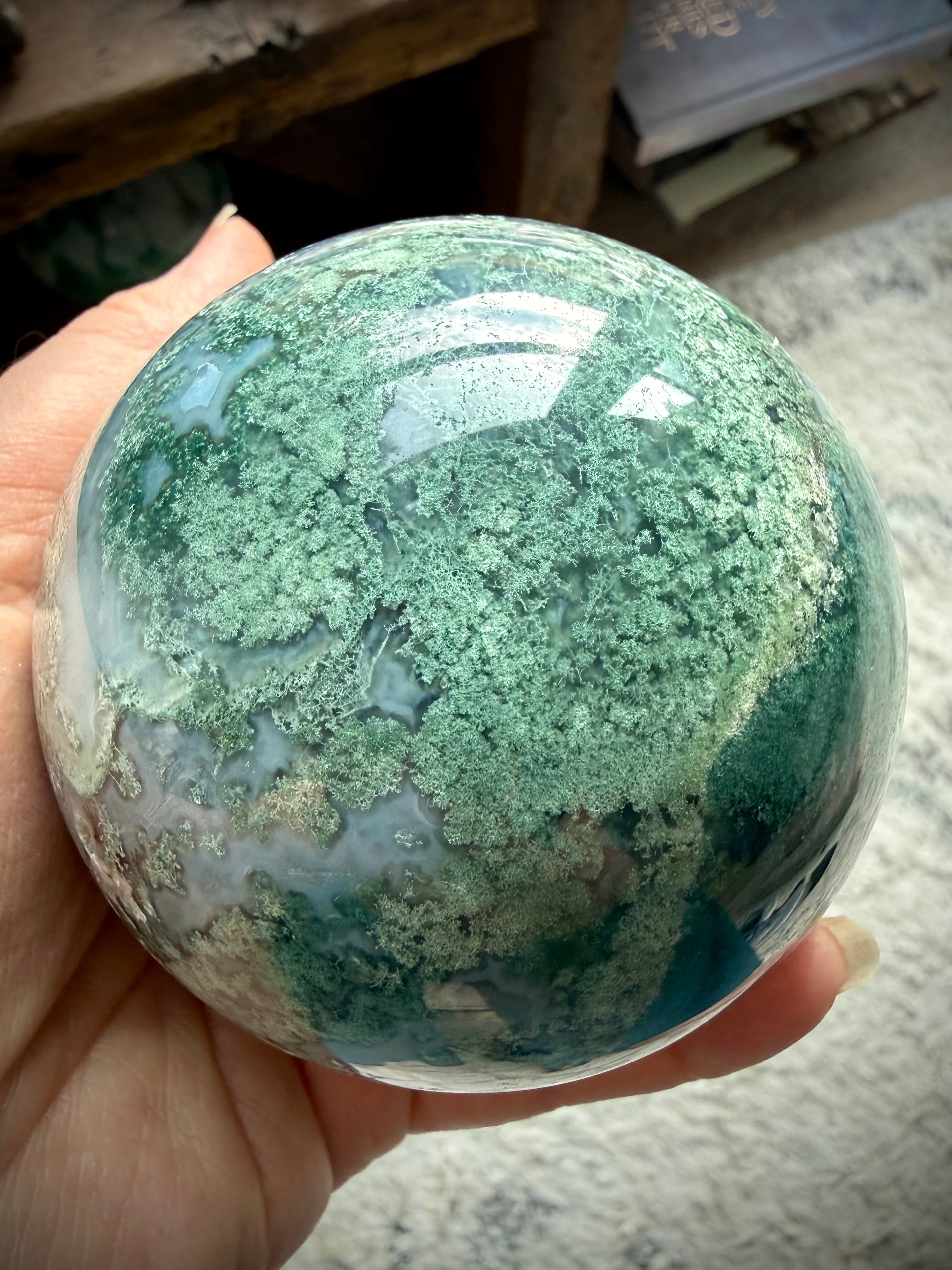 Lacy Moss Agate sphere with stand featuring natural Quartz details and one of a kind crystal patterns