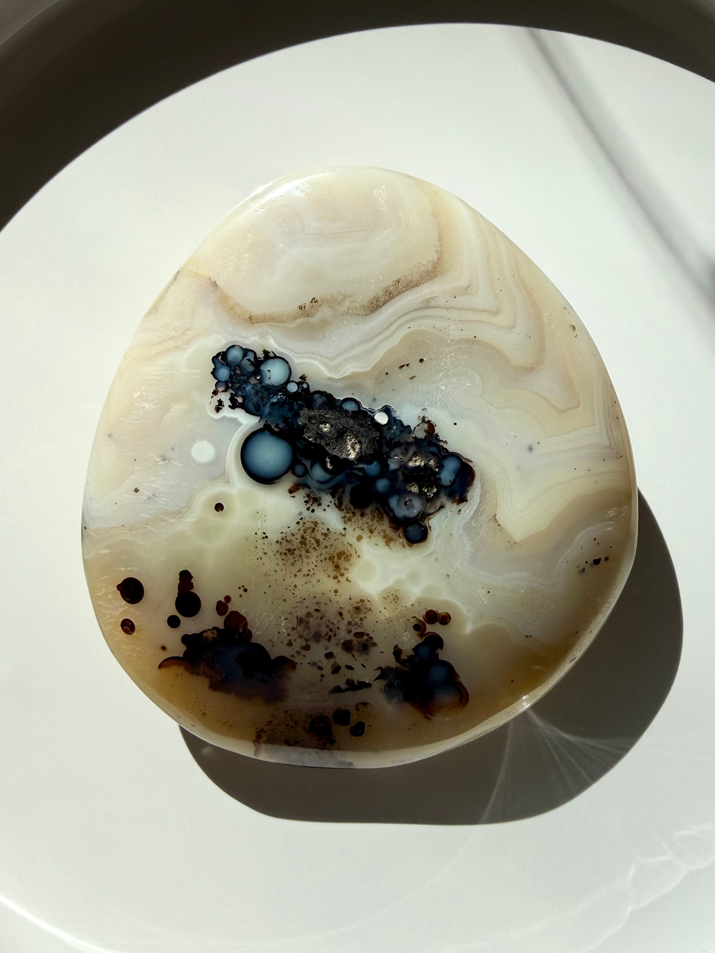 Dendritic Agate freeform with creamy white banding and black dendritic inclusions, grounding crystal for growth, abundance and stability