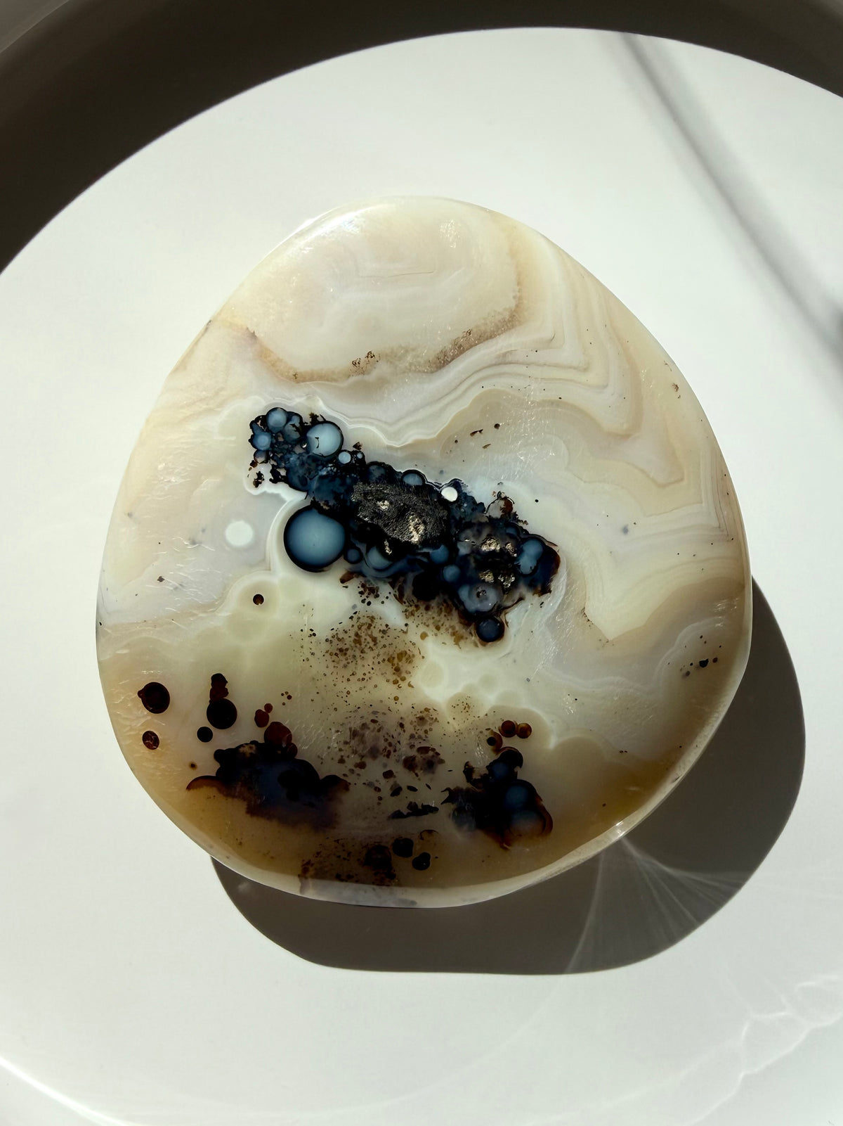 Dendritic Agate freeform with creamy white banding and black dendritic inclusions, grounding crystal for growth, abundance and stability