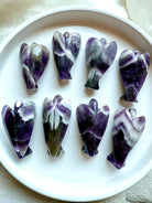 Chevron Amethyst angel carvings back view – unique white and purple patterns in Dream Amethyst angels