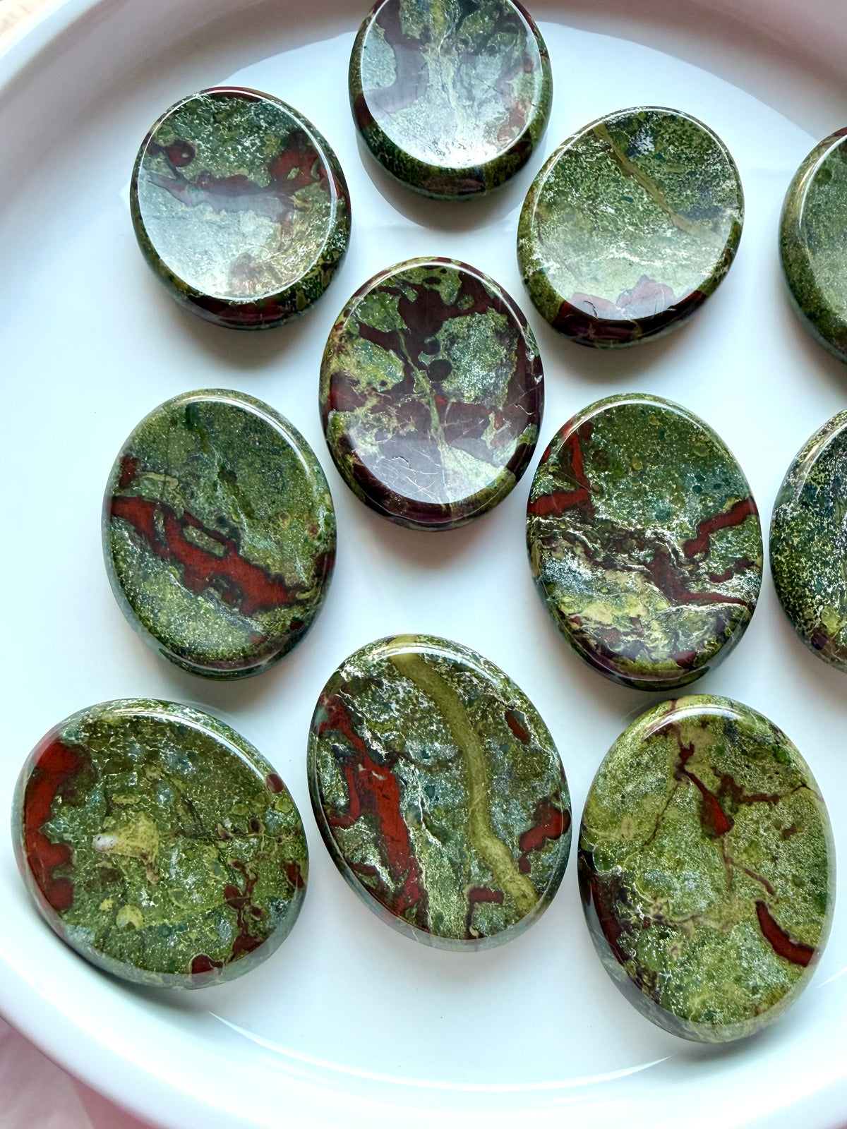 Dragon Blood Stone worry stones featuring forest-green Epidote and deep red Piemontite, polished thumb stones for strength and courage
