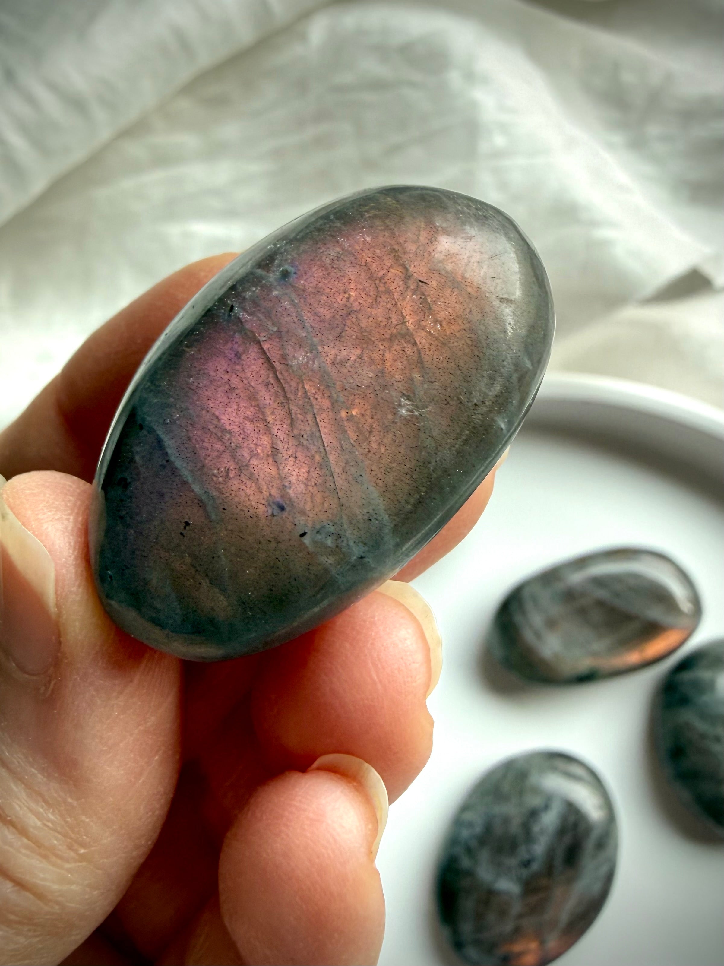 Sunset Labradorite meditation palm stone with orange labradorescence