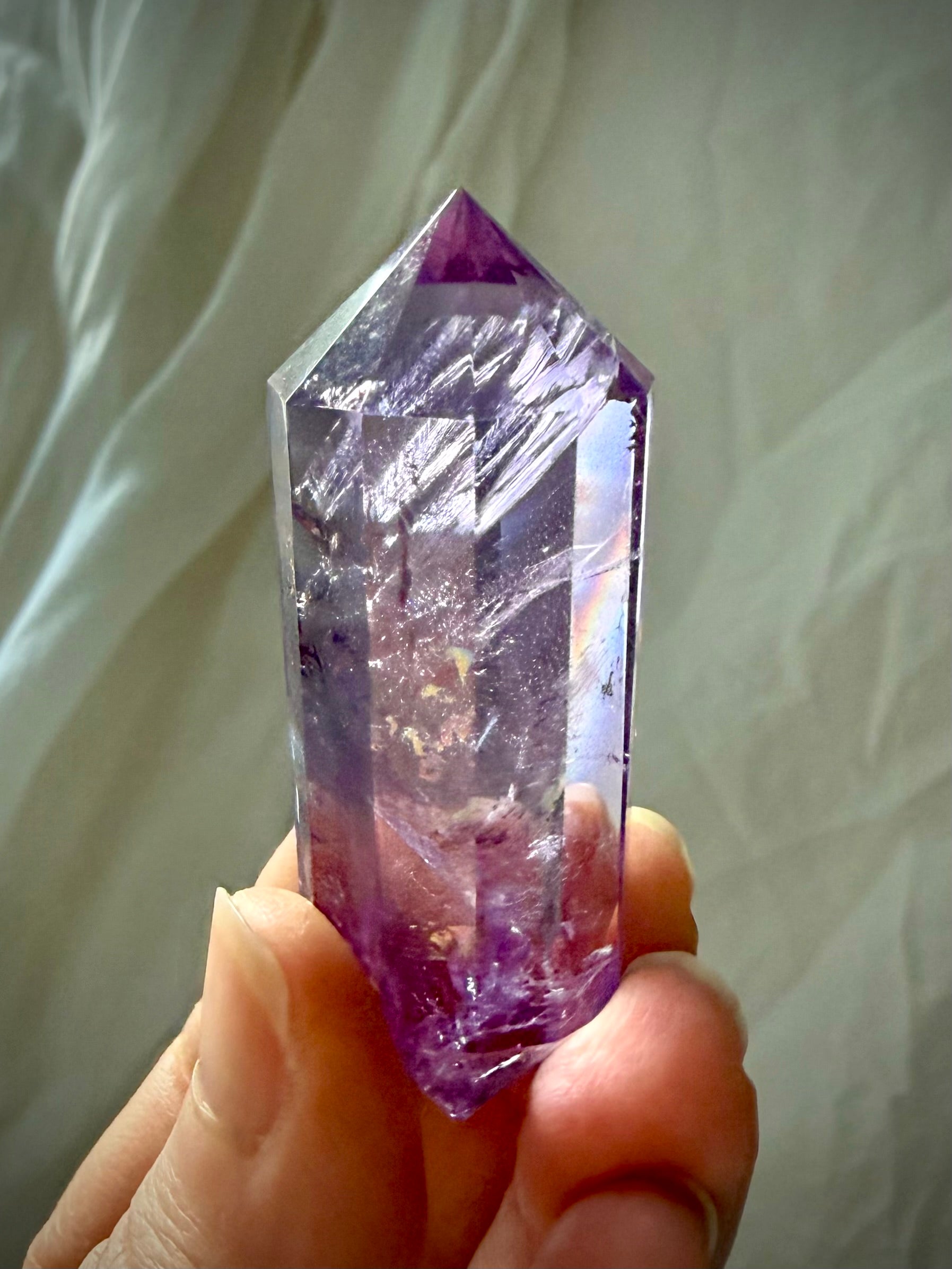 Precision faceted Amethyst Vogel cut crystal wand with beautiful internal veils and dimensional purple tones
