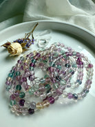 Fluorite crystal bracelets layered together to emphasize color harmony and energetic balance