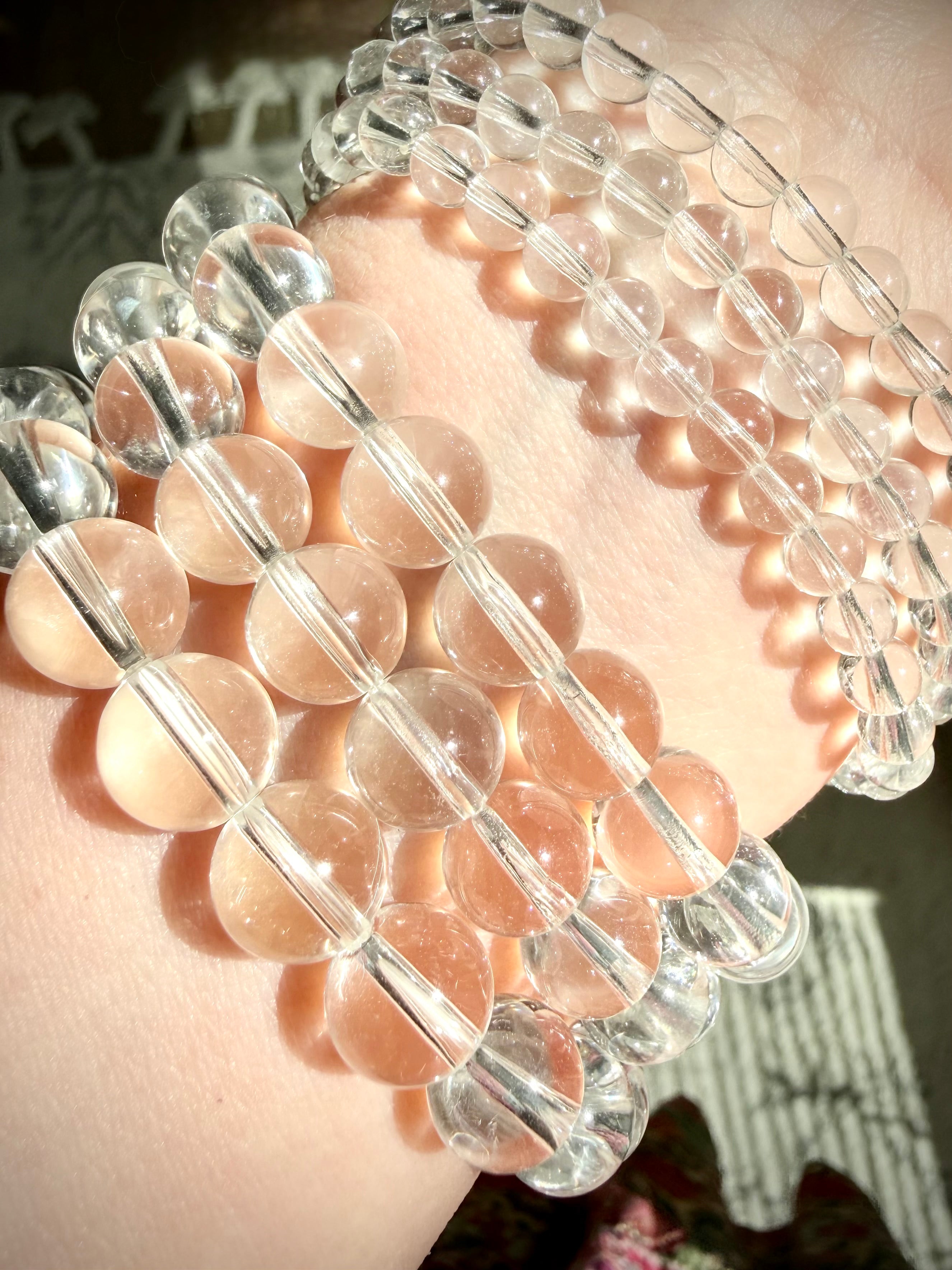 High clarity Clear Quartz bracelets displayed on wrist with natural transparent crystal beads