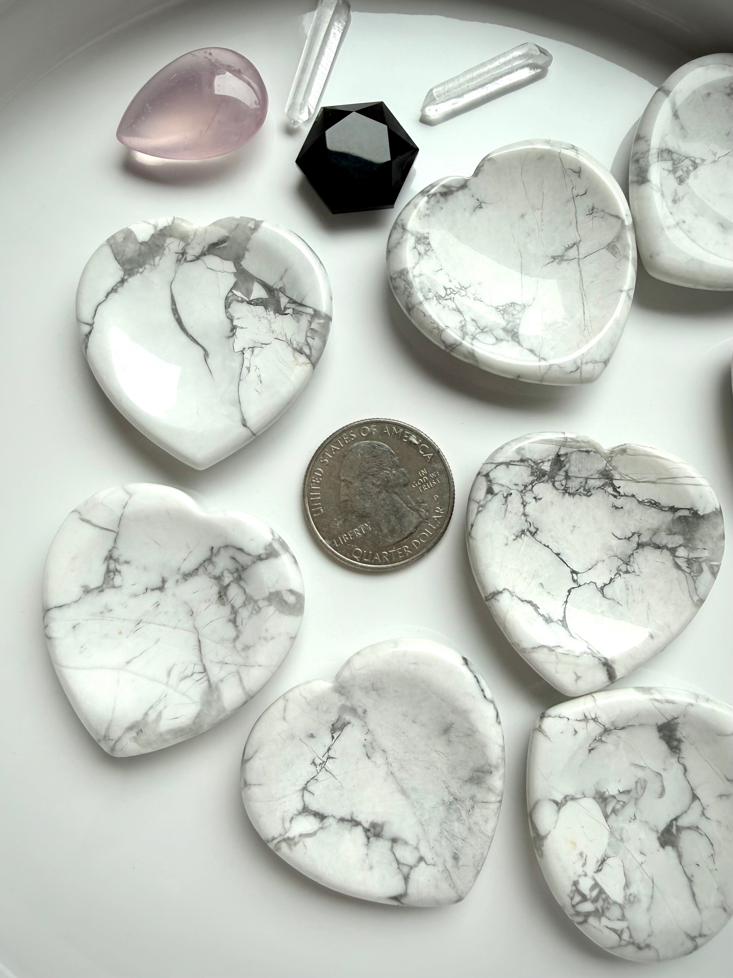 Howlite heart worry stones with US quarter showing size comparison