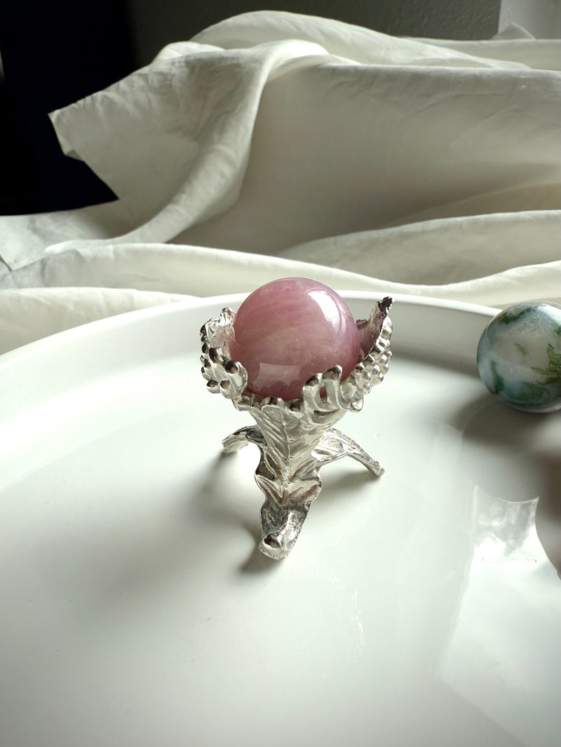 Our elegant botanical mini sphere stand fits small crystal spheres, shown with a rose quartz sphere