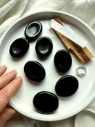 Black Obsidian thumb stones with Palo Santo + selenite – grounding crystals for meditation + energetic protection