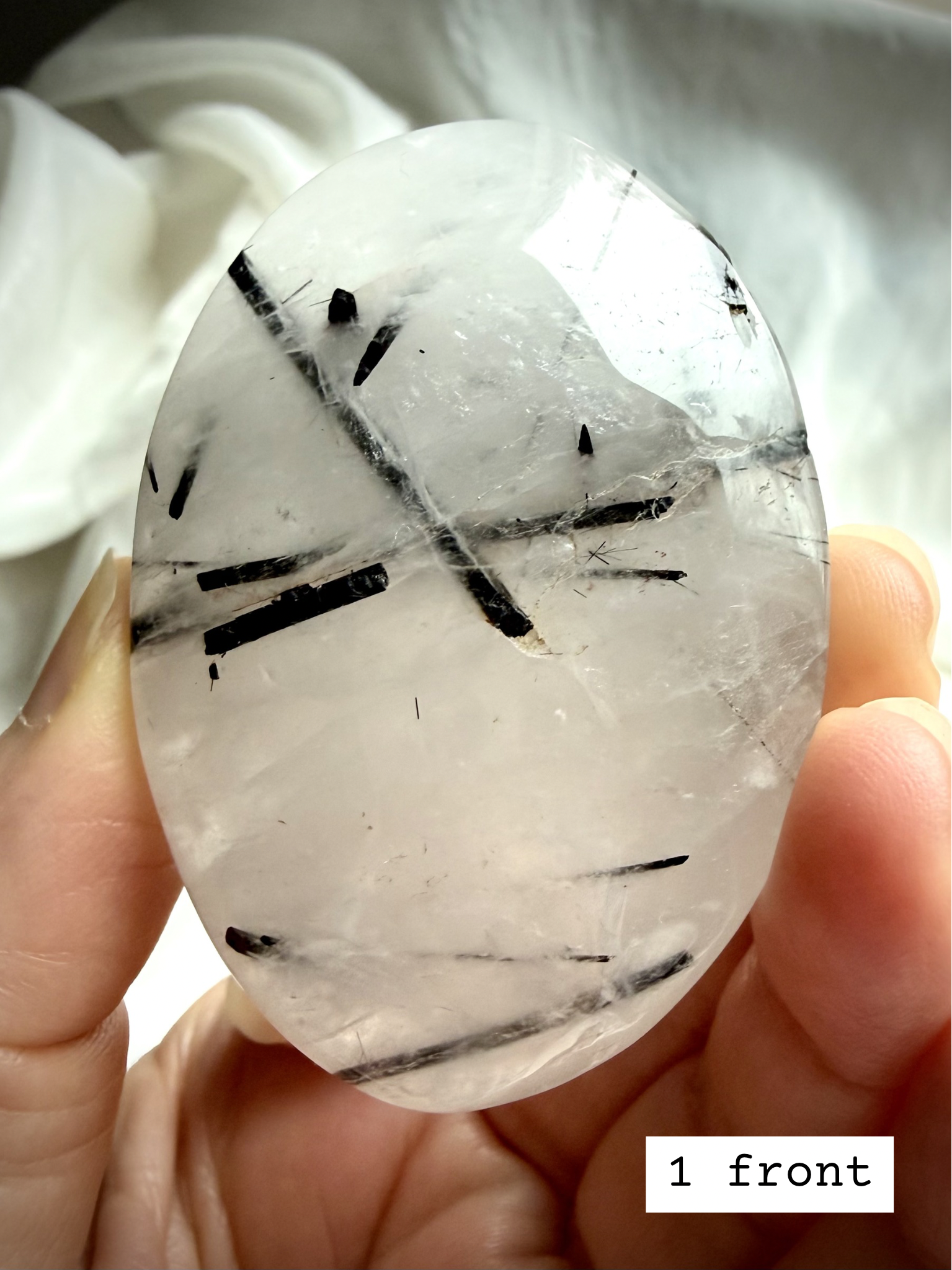 Black Tourmaline in Quartz palm stone 1 front view Tourmalinated Quartz protection crystal