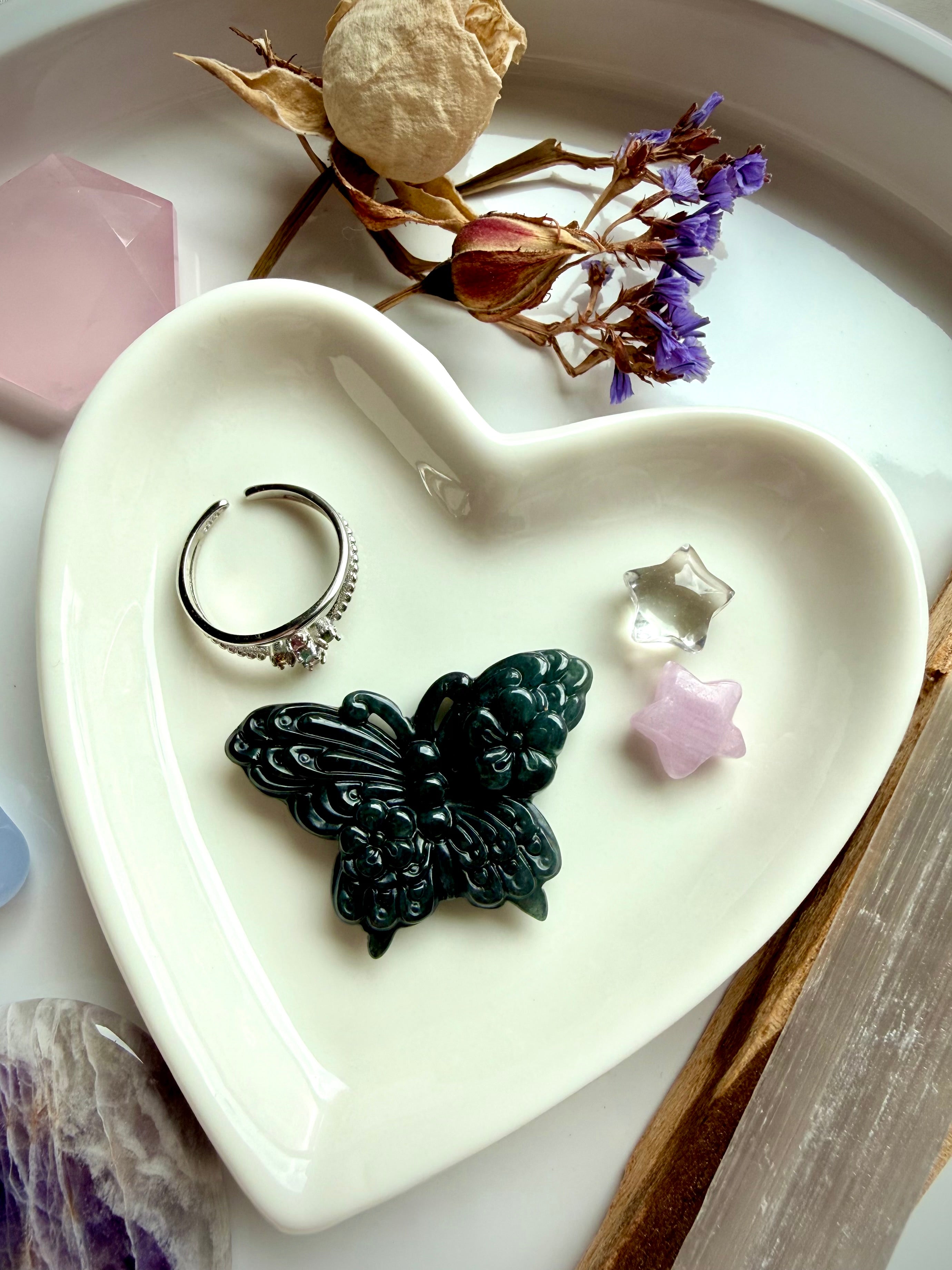 Wuji jade butterfly carving displayed on heart dish altar with Guatemalan jade crystal butterfly