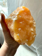 Orange Calcite statement piece from Mexico with glowing orange color and self-standing display shape