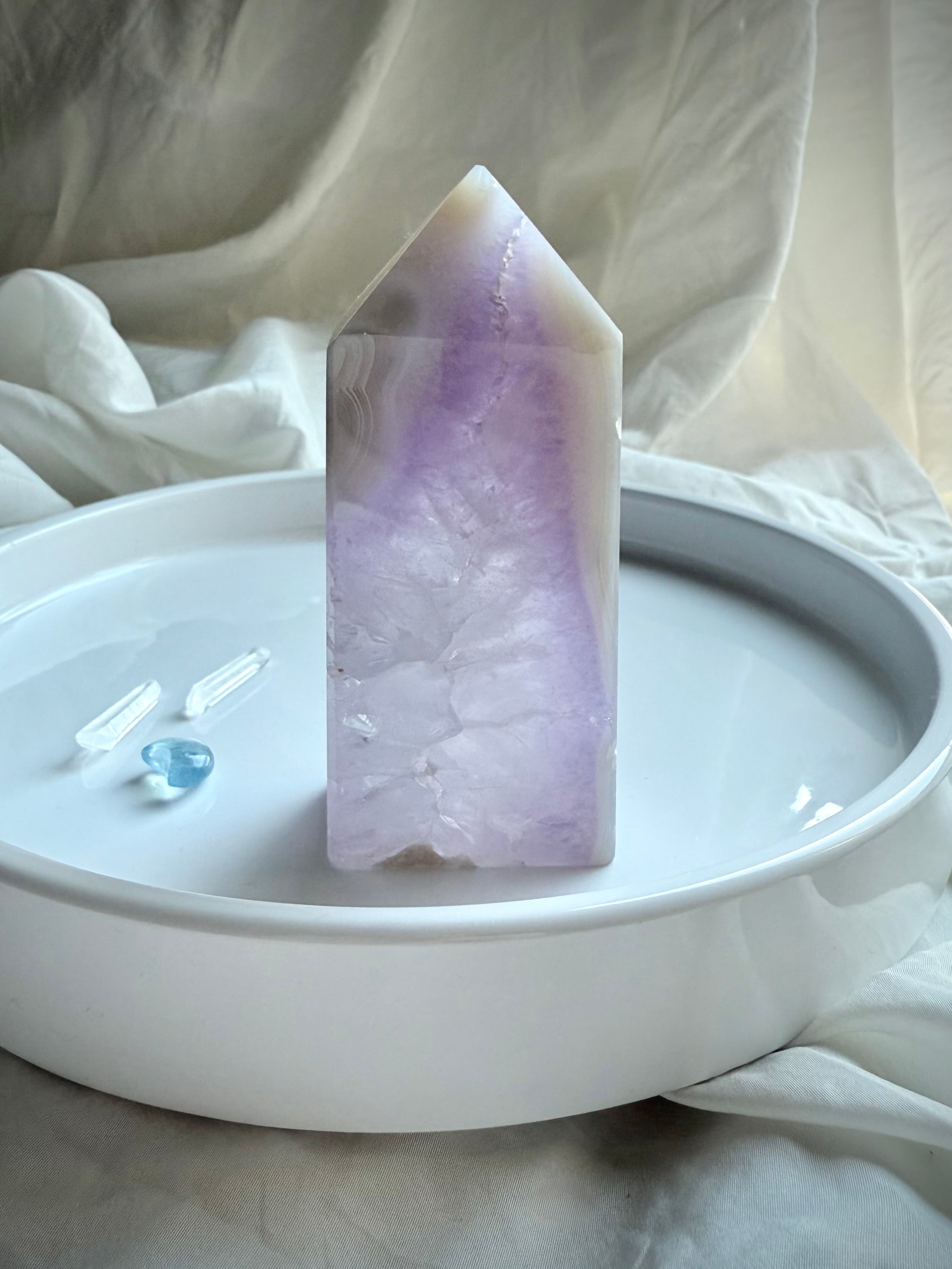 Polished Amethyst Geode Tower with white agate edge displayed on white ceramic tray